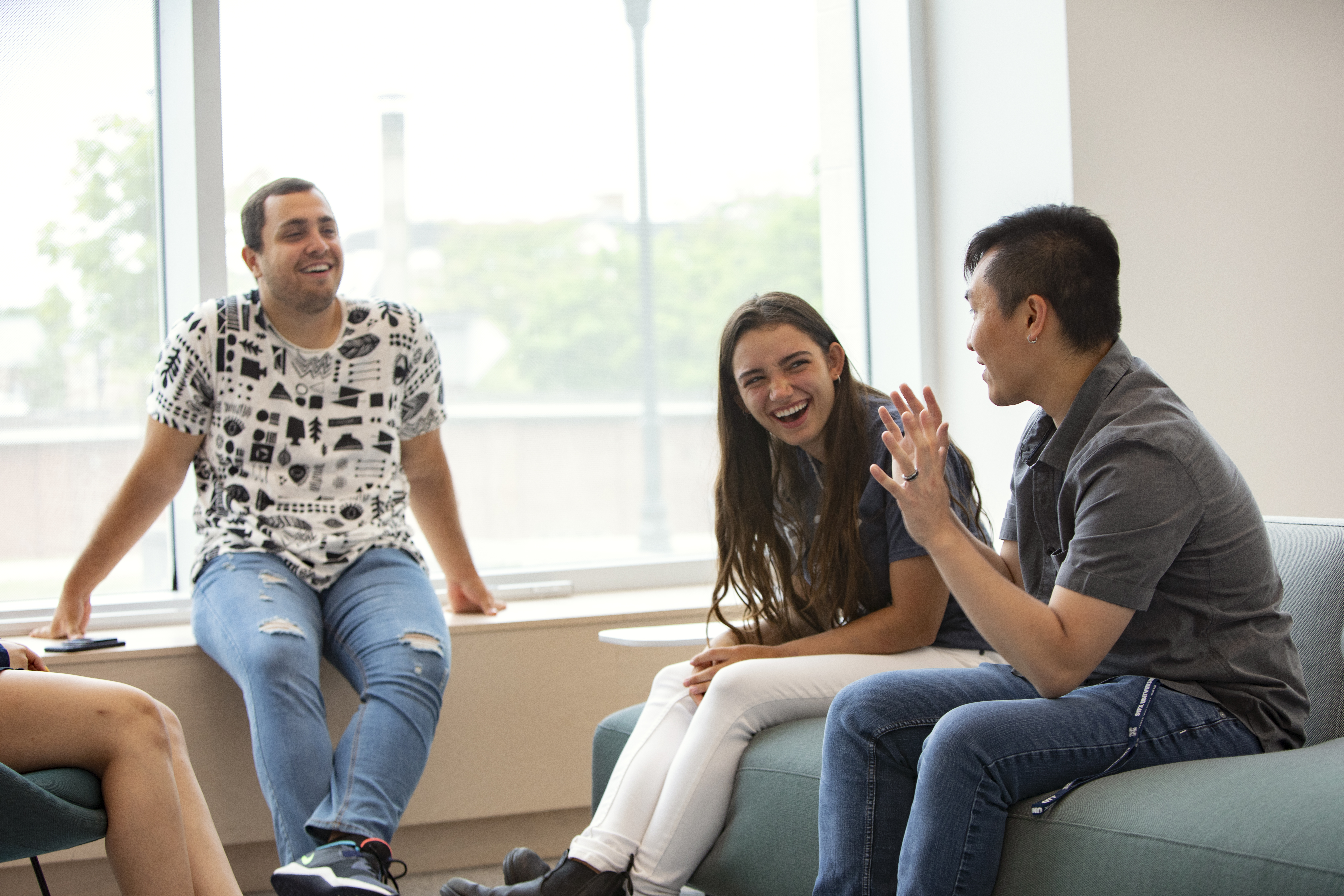 Students interacting on the first floor of Mulroney Hall