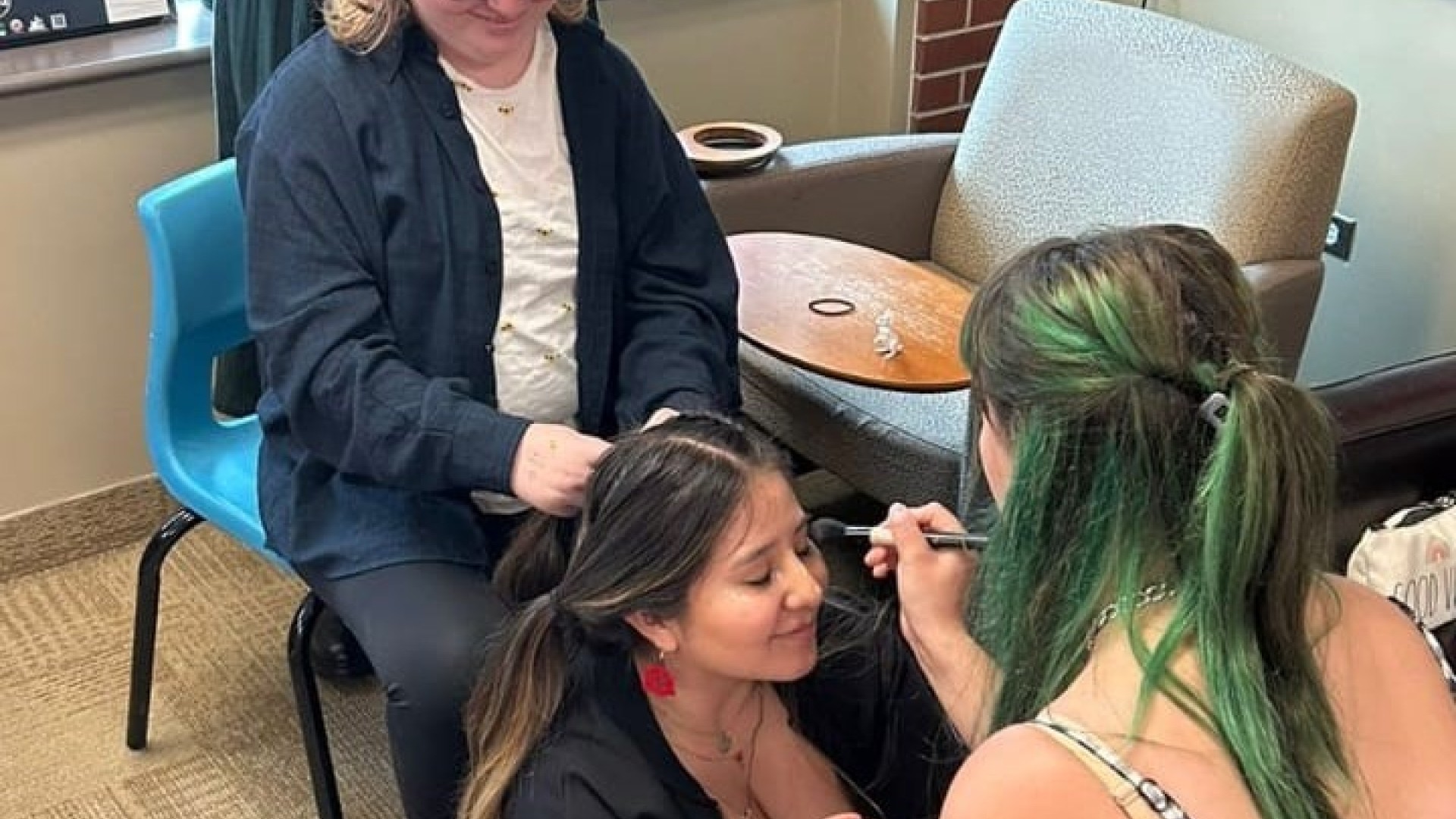 Braiding hair at skill share night