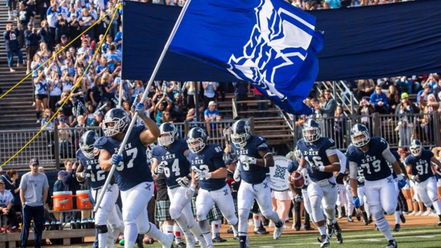 StFX X-Men Football team running onto the field