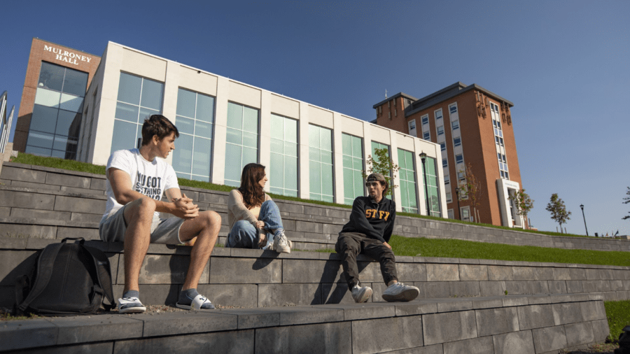 Students on steps of Mulroney Hall