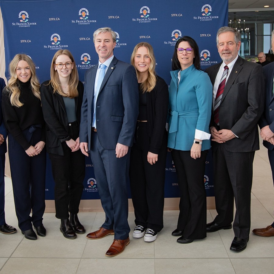 A group photo of Michelle Thompson, Tim Houston, Andy Hakin, and others after the health funding accouncement..