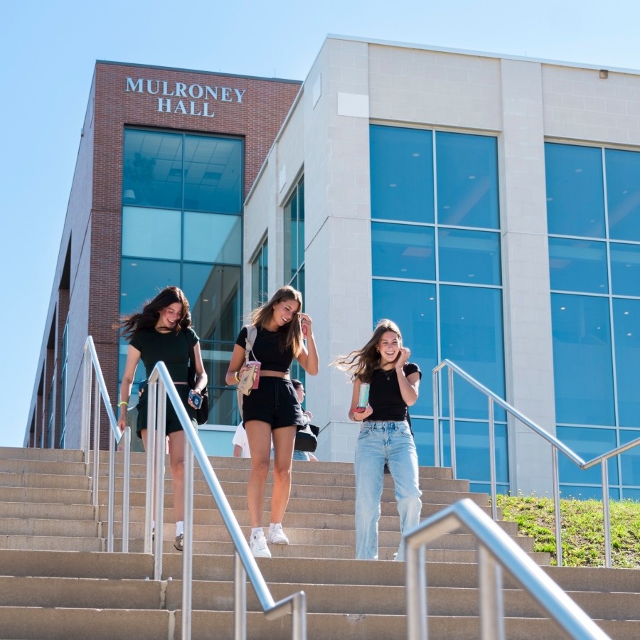 Students walking down the steps outside of Mulroney Hall