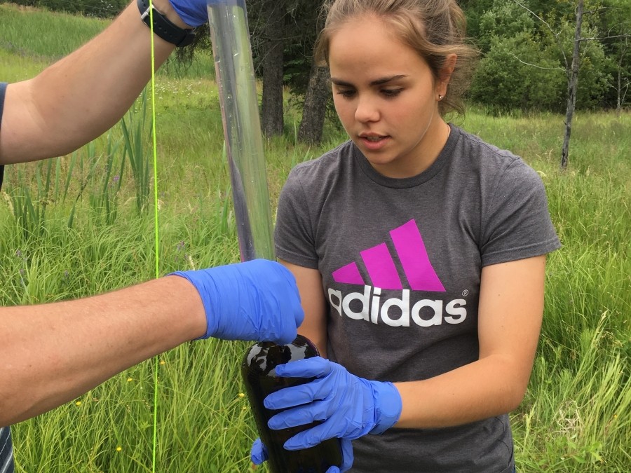 A young person testing groundwater