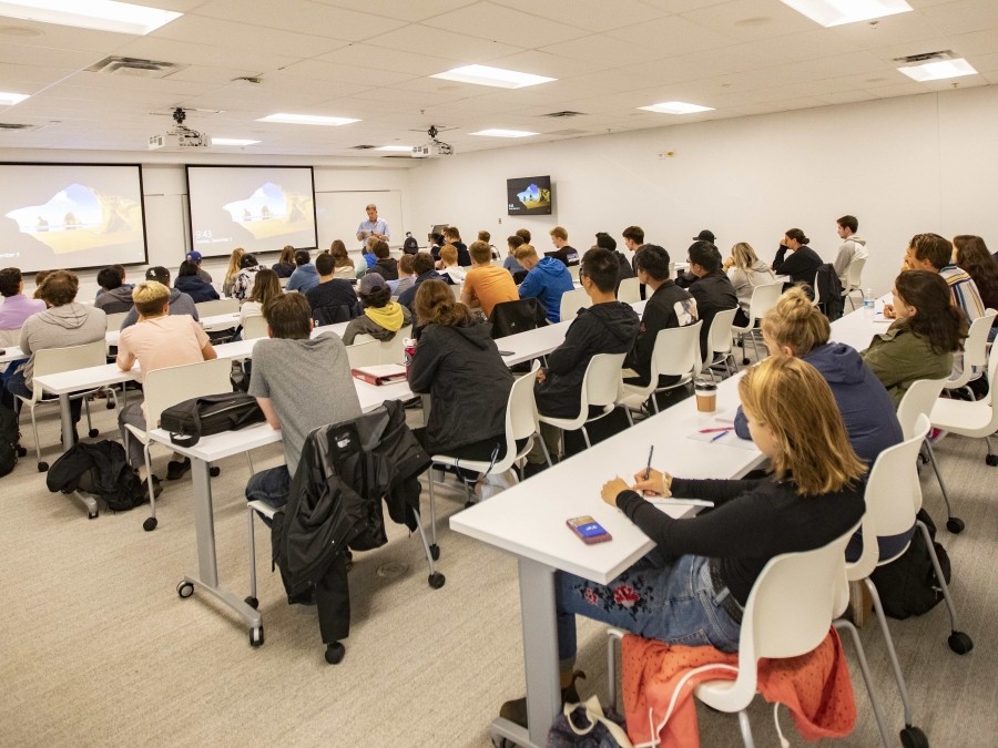 Students sitting behind desks in the classroom