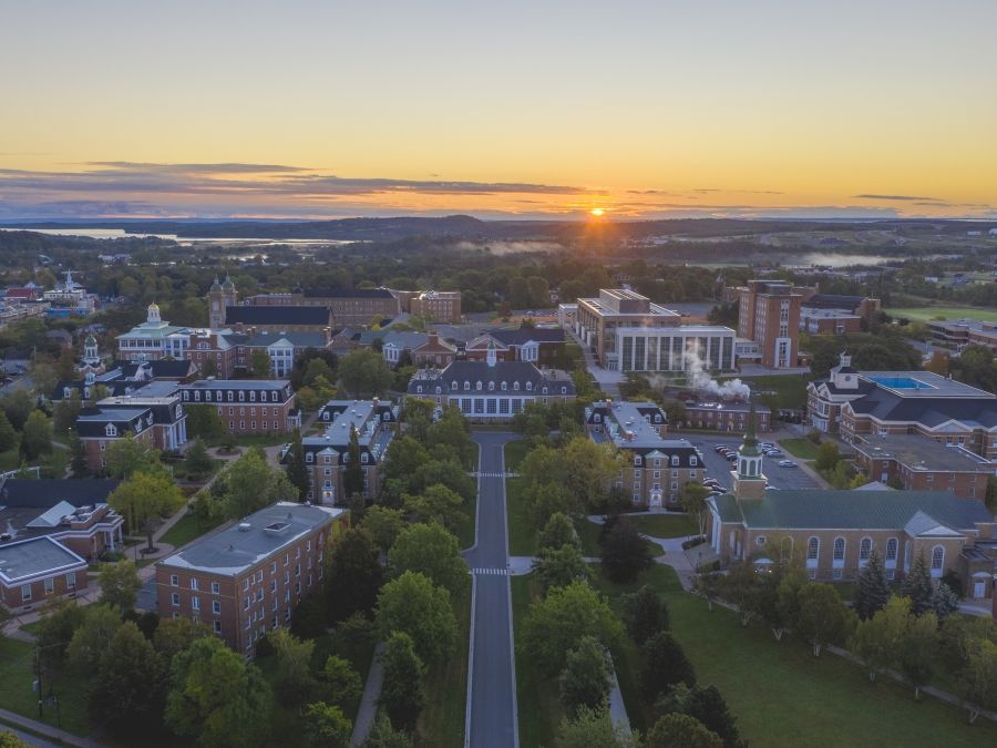 An aerial image of the StFX campus and the surrounding area at sunset. 